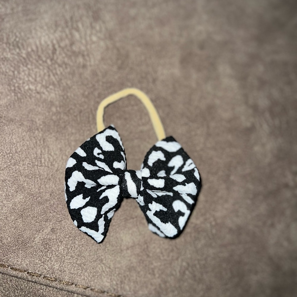 Cow print bow. Handmade these bows!!